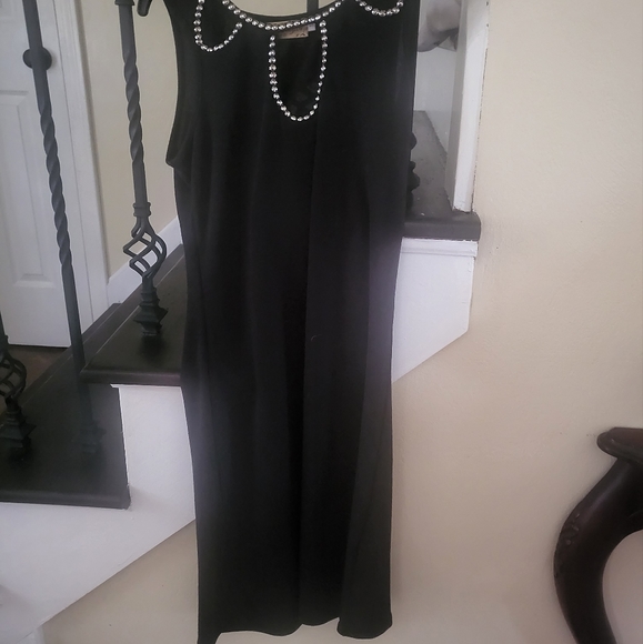Black form fitting dress with beads on top and openings. Size small. - Picture 2 of 6